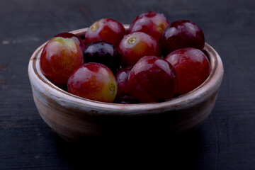 fresh red grapes in a bowl