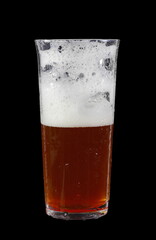 Irish red ale isolated on a black background.