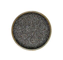 Poppy seeds in a bowl isolated on white background. Heap of dry poppy seeds