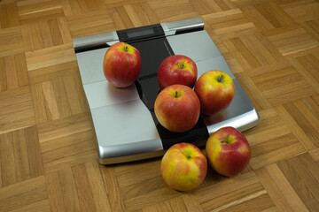 Ripe apples on a personal scale