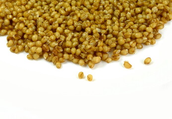 Cooked bulgur wheat isolated on white.