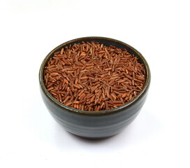 Red wild rice in a bowl isolated on white background