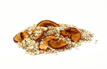 Healthy food. Rye oat flakes with dried apple isolated on white , macro close up