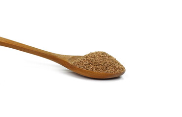 Ground carob powder (Ceratonia siliqua) in a wooden spoon isolated on white background. Ripe carob pods and carob powder, can be used as a substitute for cocoa.