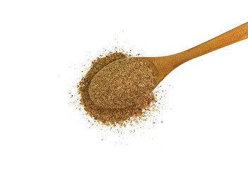 Ground carob powder (Ceratonia siliqua) in a wooden spoon isolated on white background. Ripe carob...