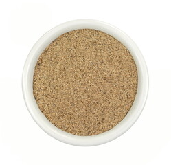 Ground carob powder (Ceratonia siliqua) in a bowl isolated on white background. Ripe carob pods and carob powder, can be used as a substitute for cocoa.