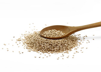 Organic integral sesame seeds in a wooden spoon isolated on white background.