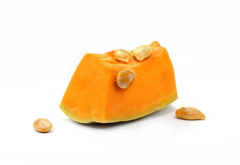 Piece of pumpkin isolated on white background. Pumpkin seed. Pumpkin pieces cut in a cube slice isolated on white background. 