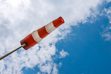 Windsock flag. Windsock indicator of wind on runway airport