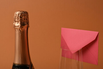 Champagne bottle, glass and envelope. Symbol of love and romance