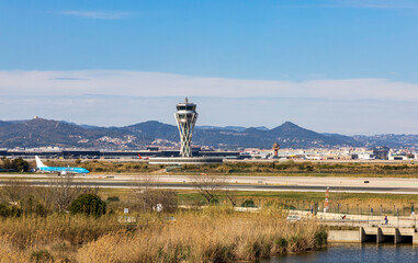 Landing strip at Barcelona airport with planes on the runway