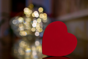 red heart with blurred lights background. Valentine's Day.