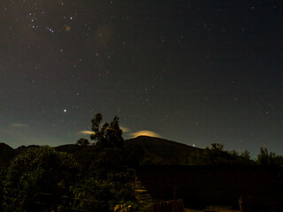 Fototapeta premium Long exposure night landscape illuminated by the full moon, near the colonial town of Villa de Leyva in the central Andean mountains of Colombia.
