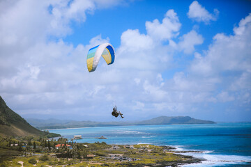 Paraglider at Makapuu, Honolulu Oahu, Hawaii. Paragliding is the recreational and competitive adventure sport of flying paragliders