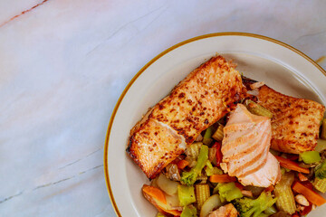 Fillet of salmon with asian stir-fry vegetables.
