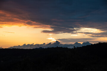 Scenic canyon view of meanders on the river Uvac, on the Zlatar Mountain with beautiful sunset with colorful and dramatic clouds and sky in background. Uvac is a special nature reserve in Serbia.