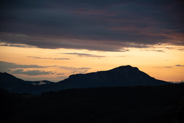 Scenic canyon view of meanders on the river Uvac, on the Zlatar Mountain with beautiful sunset with colorful and dramatic clouds and sky in background. Uvac is a special nature reserve in Serbia.