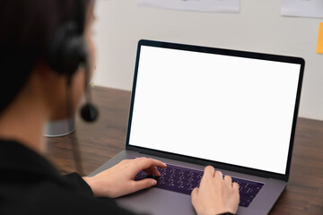 Business women hand using laptop and type on the keyboard. Mockup screen of advertisement.