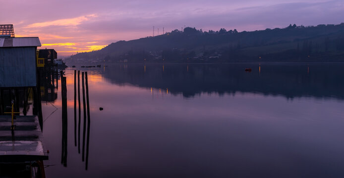 Sunset in Castro city along its stilt houses or palafitos, Chiloe Island, Chile.