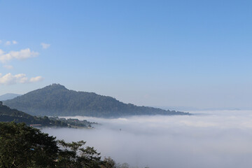 Beautiful blue sky with white fluffy clouds in sunny day with mountain background