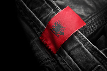 Tag on dark clothing in the form of the flag of the Albania