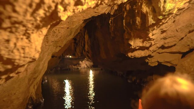 Flowing in a boat though the cave which goes through the limestone muntain in Ninh Binh, a tourist destination in northern Vietnam. Travel to Vietnam concept
