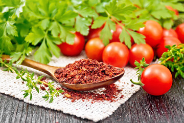 Tomatoes dried in spoon on board