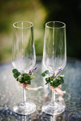 Two wedding champagne glasses decorated lavender.