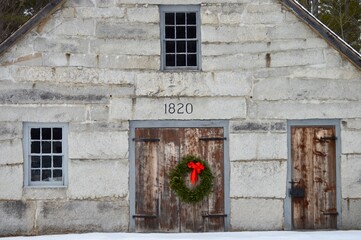 1820 stone building with Christmas wreath