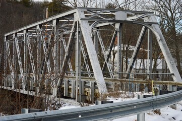 small steel trestle bridge over river