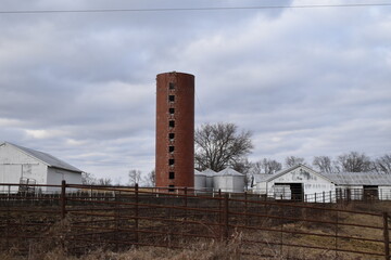 Farm with a Silo, Grain Bins, and a Barn