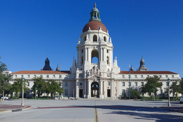This image shows the facade of the Pasadena City Hall against a beautiful blue sky. The City of Pasadena is within Los Angeles County.