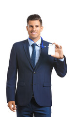 Elegant man in suit with blank badge on white background