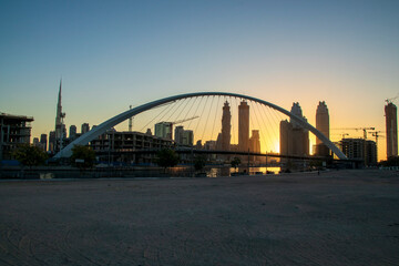 Naklejka premium Dubai, UAE - 01.08.2021 Bridge over a Dubai Water canal known as Tolerance bridge. Outdoors