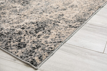 Beautiful soft carpet on wooden floor