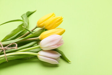 Bouquet of beautiful tulips on color background