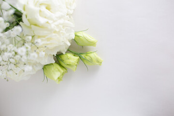 Flower frame, eustoma of a white and delicate color on a light background.