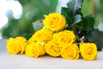 Beautiful yellow roses on table outdoors