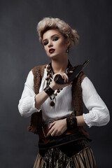 Beautiful blonde girl in steampunk style costume