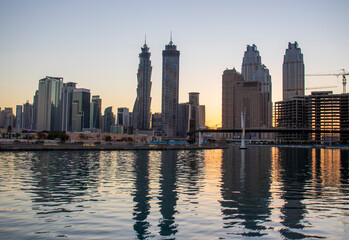 Fototapeta na wymiar Dubai, UAE - 01.08.2021 View of the Dubai city skyline at Dubai Water Canal. Business Bay district. Outdoors