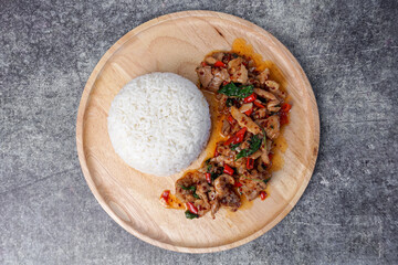 Thai street food, stir-fried pork with basil and rice.
