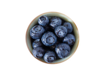 Top view of fresh blueberry in a ceramic bowl isolated on white background. Macro and closeup.