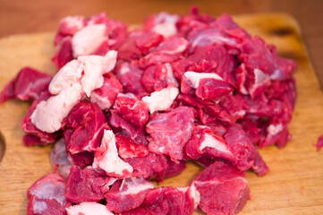 Chopped beef meat on the butcher's table. Beef meat in chunks.