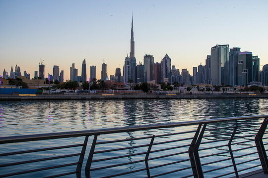 Dubai, UAE - 01.08.2021 View of the Dubai city skyline at Dubai Water Canal. Business Bay district. Tallest building in the world Burj Khalifa can be seen in the picture. Outdoors