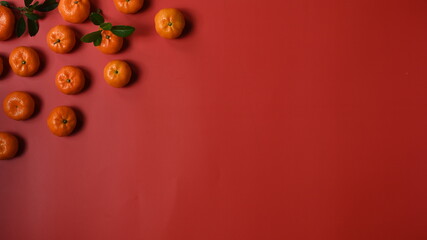 Top view of fresh orange on red table and copy space. Chinese New Year.