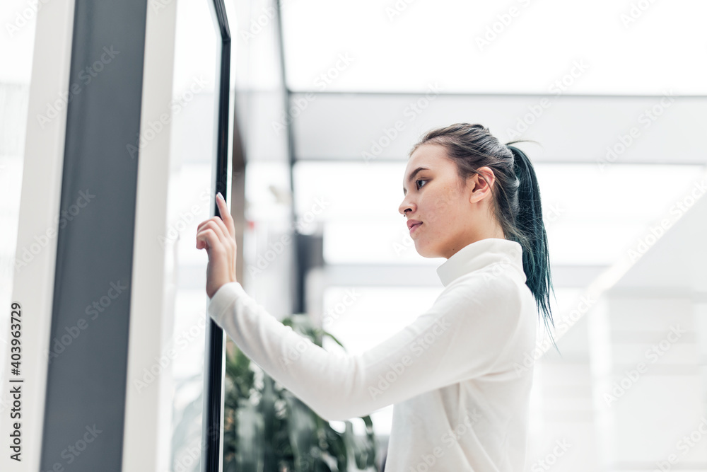 Wall mural virtual shopping on a screen at a shopping mall