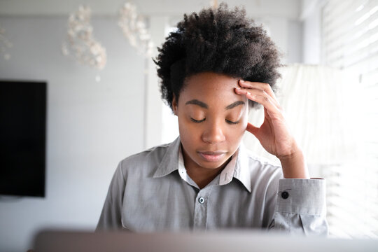 Oman Feeling Tired While Working From Home On A Laptop