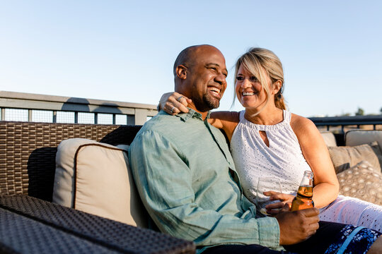 Husband and wife relaxing on their rooftop during covid-19 lockdown