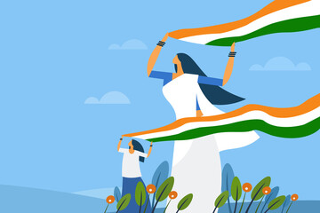 A mother and daughter holding the Indian tricolour flag flying in the wind