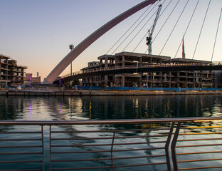 Dubai, UAE - 01.08.2021 Bridge over a Dubai Water canal known as Tolerance bridge. Outdoors